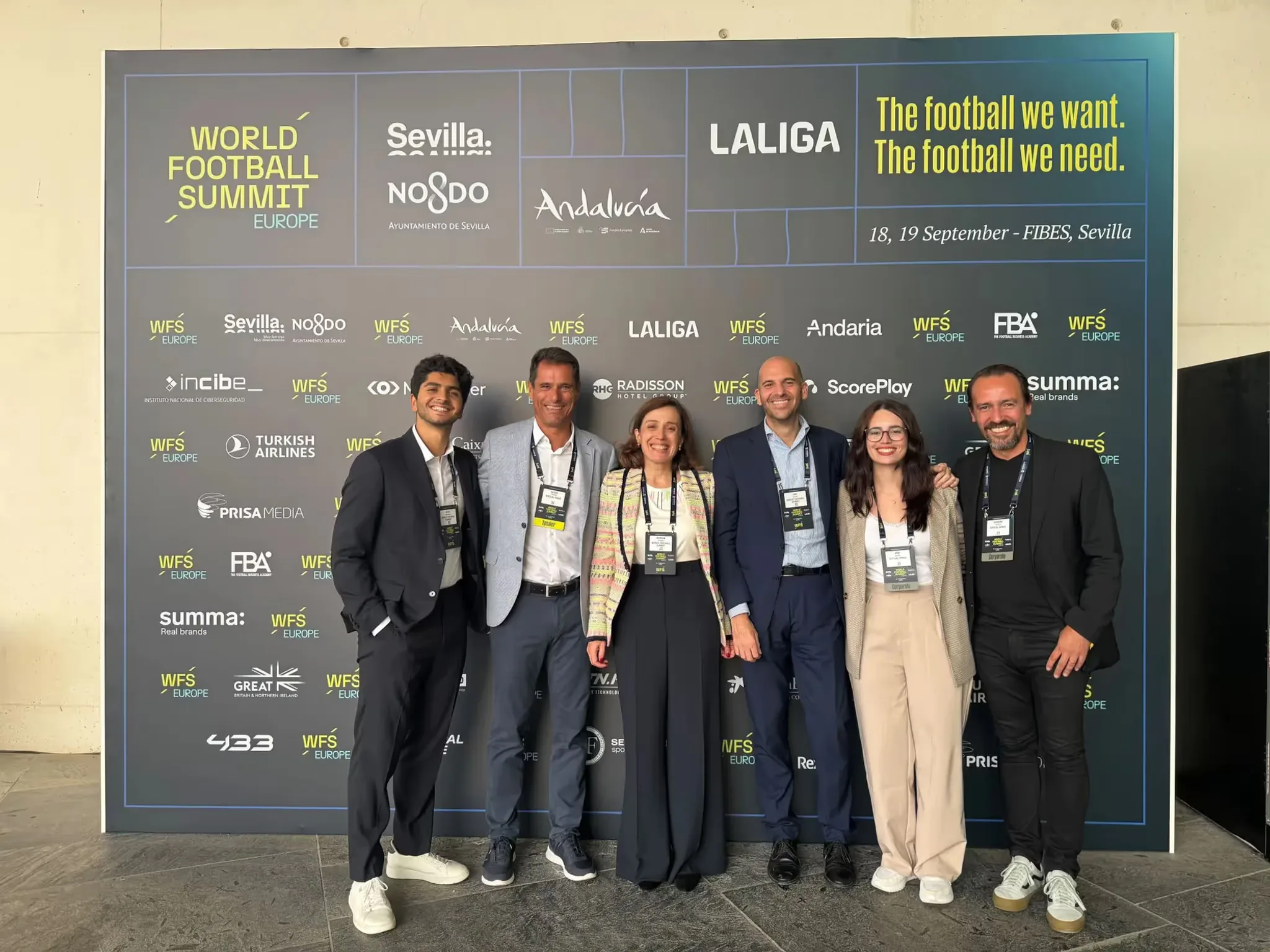 Virtual Venue and World Football Summit logos side by side, celebrating renewed partnership for 2025 with a backdrop of Seville.