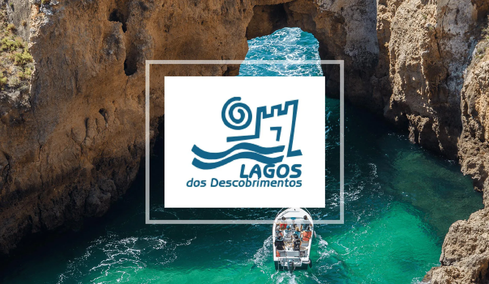 turquoise water between rocky sea cliffs in Lagos, Portugal, with the “Lagos dos Descobrimentos” logo centered over the image.
